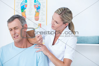 Doctor stretching her patient neck