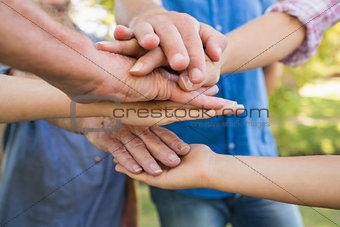 Family putting their hands together