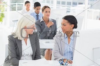 Businesswoman checking her colleagues works