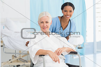 doctors and patient in wheelchair