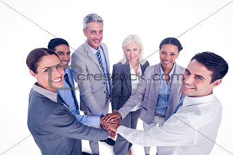 Executives holding hands together