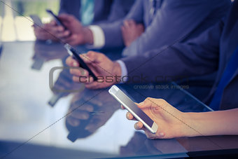 Business team using their smartphones