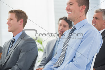 Businessmen listening conference presentation