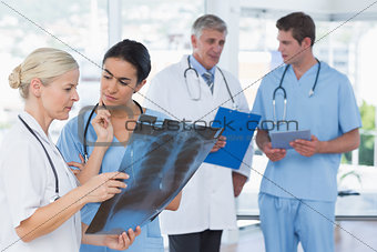 Team of smiling doctors discussing