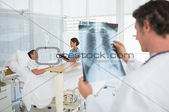 Doctor checking patients xray