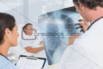 Doctors checking patients xray