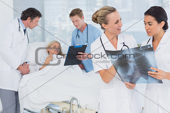 Doctors discussing about patients file