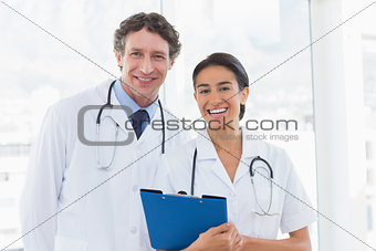 Happy doctors looking at camera