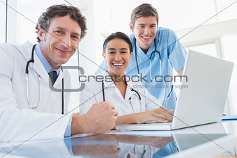 Team of doctors smiling at camera