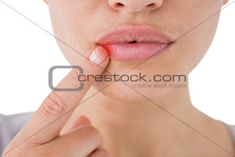 Composite image of woman pointing her lips
