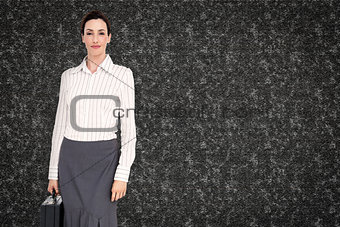 Composite image of businesswoman holding briefcase