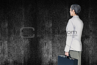 Composite image of businesswoman standing
