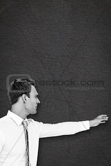 Composite image of businessman reaching