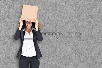 Composite image of anonymous businesswoman holding a megaphone