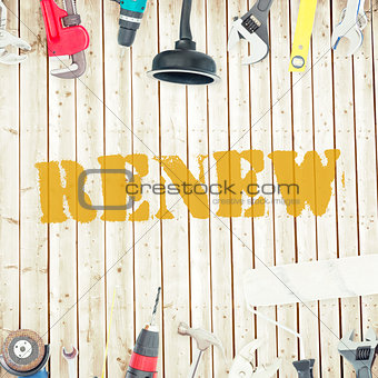 Renew against tools on wooden background