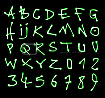 liquid font and number green neon alphabet over black