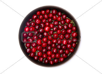 Top view of red cherry in round baking tin 