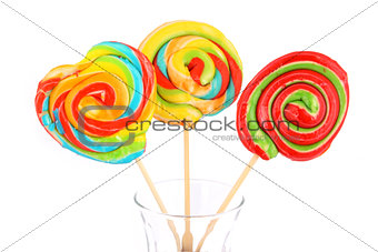 Three colorful candies isolated on white background