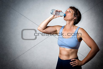 Middle aged woman drinking