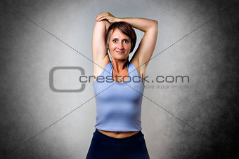Middle aged woman doing stretching