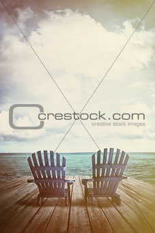 Adirondack chairs on dock with vintage textures and feel