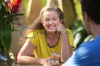 Cheerful Woman Having Drinks with Friend