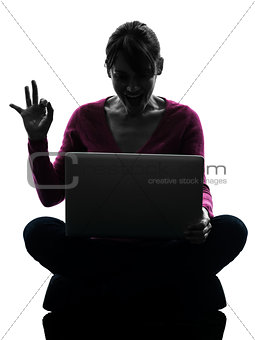 woman okay gesture computing laptop computer silhouette