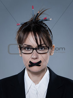 business woman with tape on lips