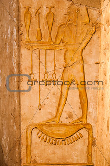 Ancient hieroglyphs carved in stone, Queen Hatshepsut temple, 