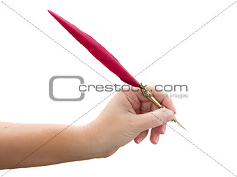hand holding feather pen
