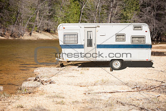 Classic Old Camper Trailer Near A River
