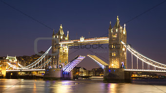 Tower Bridge raised at night