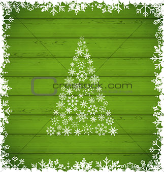  Christmas pine and border made of snowflakes on green wooden ba