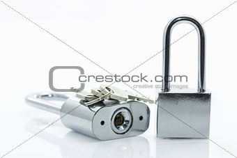 Metallic padlock with  keys on white background