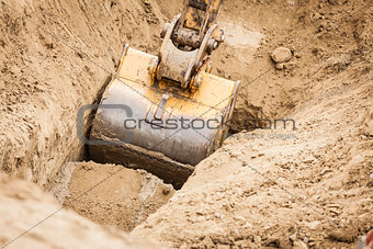 Excavator Tractor Digging A Trench