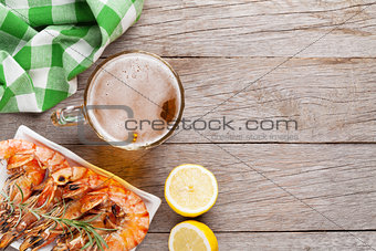 Beer mug and grilled shrimps