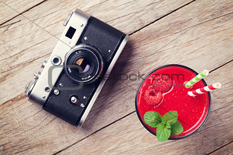 Vintage camera and raspberry smoothie