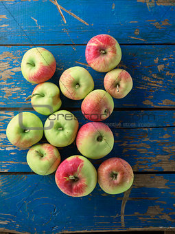 fresh and ripe apple on blue wooden table
