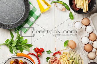 Pasta cooking ingredients and utensils on table