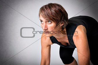 woman in running start position