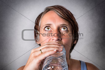 Middle aged woman drinking