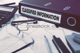 Classified Information on Ring Binder. Blured, Toned Image.