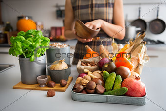 Selection of Autumn fruits and vegetables on kitchen counter