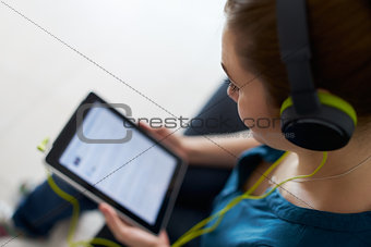 Woman With Green Headphones Listens Podcast Music Tablet PC