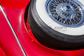Close up of spare tire on an red retro car
