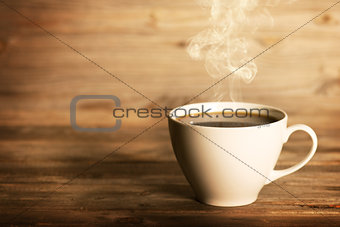 Steaming coffee in white mug