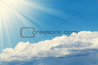 Blue sky, sun and clouds with copy space