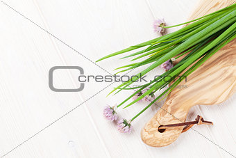 Fresh garden spring onion on white table