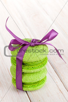 Green macarons with purple ribbon