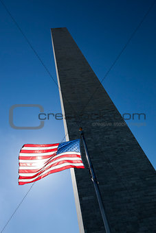 USA flag dark sky and Washington Monument